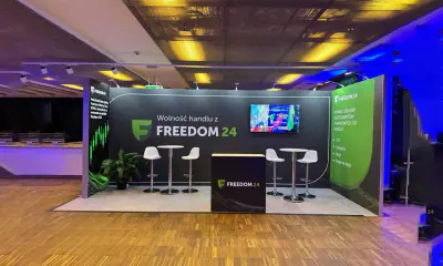 Custom exhibition booth with branded graphics built by Lines & Designs