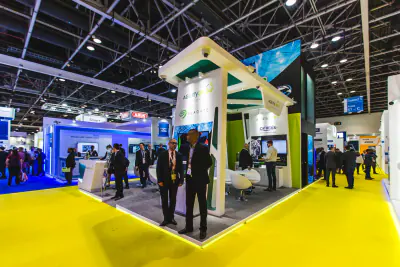 Agility exhibition stand with curved white fascia and open meeting area