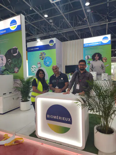 bioMerieux stand with printed walls and a lit reception counter