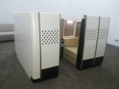 Curved perforated partition and built-in seating