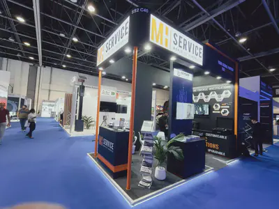 MH Service stand with dark walls and an orange structural frame