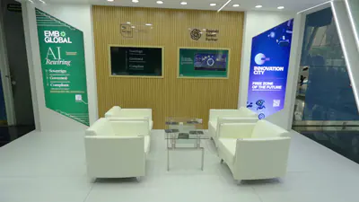 Stand interior with timber slat wall, screens and lounge seating