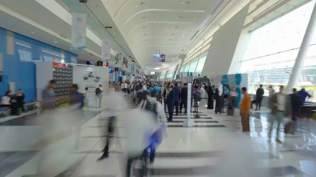 Visitors walking through the exhibition hall at ADNEC Centre Abu Dhabi