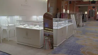 Seating corner with cream armchairs inside a display suite